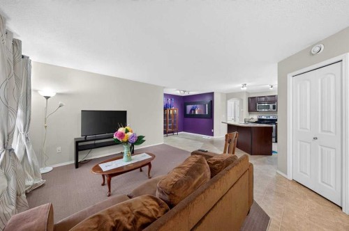 #104-20 Panatella Landing Nw, Calgary, AB - Indoor Photo Showing Living Room