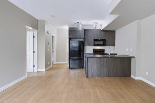 210-300 Marina Drive, Chestermere, AB - Indoor Photo Showing Kitchen