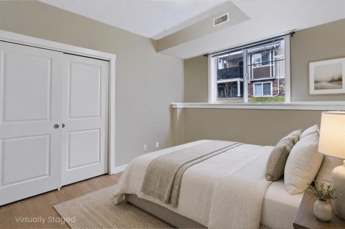 210-300 Marina Drive, Chestermere, AB - Indoor Photo Showing Bedroom