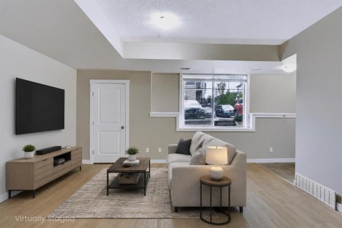 210-300 Marina Drive, Chestermere, AB - Indoor Photo Showing Living Room
