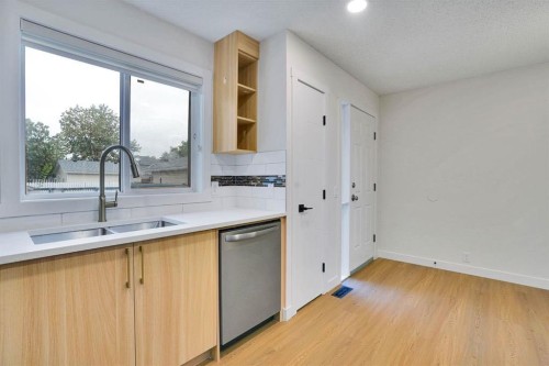 112 Martinglen Close Ne, Calgary, AB - Indoor Photo Showing Kitchen With Double Sink