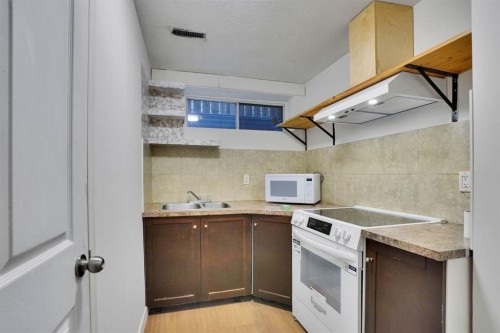 112 Martinglen Close Ne, Calgary, AB - Indoor Photo Showing Kitchen With Double Sink