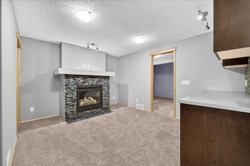 177 Royal Birch Terrace Nw, Calgary, AB - Indoor Photo Showing Living Room With Fireplace