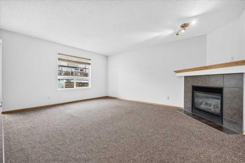 177 Royal Birch Terrace Nw, Calgary, AB - Indoor Photo Showing Living Room With Fireplace