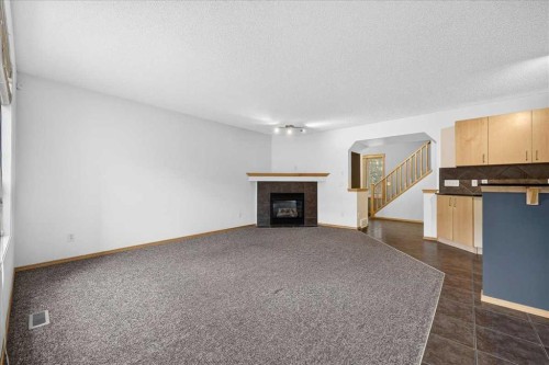 177 Royal Birch Terrace Nw, Calgary, AB - Indoor Photo Showing Living Room With Fireplace
