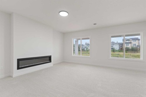 425 Montrose Green Se, High River, AB - Indoor Photo Showing Other Room With Fireplace