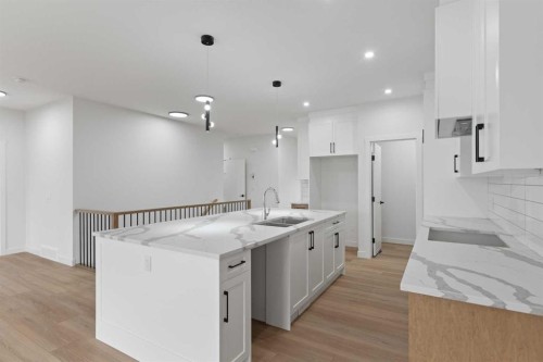 425 Montrose Green Se, High River, AB - Indoor Photo Showing Kitchen With Upgraded Kitchen