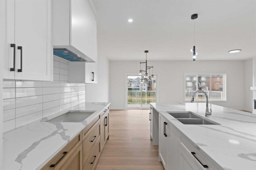 425 Montrose Green Se, High River, AB - Indoor Photo Showing Kitchen With Double Sink With Upgraded Kitchen