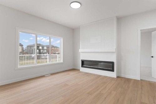 425 Montrose Green Se, High River, AB - Indoor Photo Showing Living Room With Fireplace