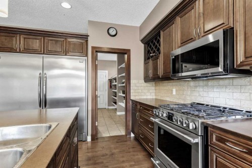 103 Tuscany Estates Crescent Nw, Calgary, AB - Indoor Photo Showing Kitchen With Stainless Steel Kitchen With Upgraded Kitchen
