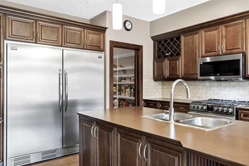 103 Tuscany Estates Crescent Nw, Calgary, AB - Indoor Photo Showing Kitchen With Stainless Steel Kitchen With Double Sink With Upgraded Kitchen