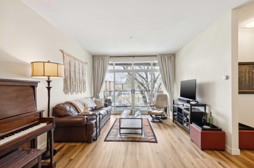 204-540 34 Street Nw, Calgary, AB - Indoor Photo Showing Living Room