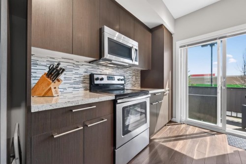 355 Silverado Common Sw, Calgary, AB - Indoor Photo Showing Kitchen With Upgraded Kitchen