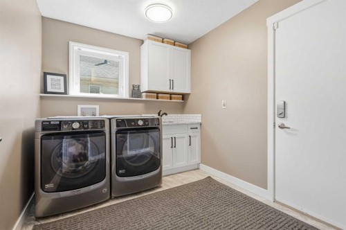 12078 Diamond View Se, Calgary, AB - Indoor Photo Showing Laundry Room