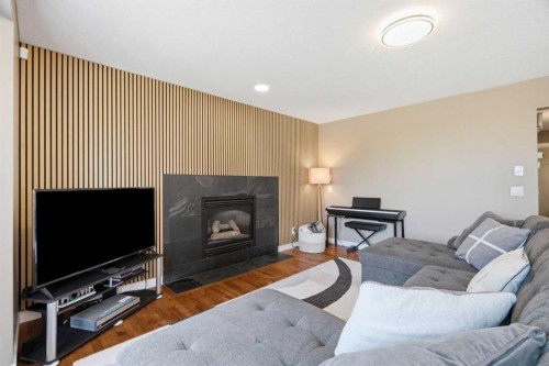 12078 Diamond View Se, Calgary, AB - Indoor Photo Showing Living Room With Fireplace