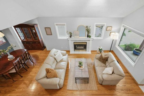 4 Inglewood Landing Se, Calgary, AB - Indoor Photo Showing Living Room With Fireplace