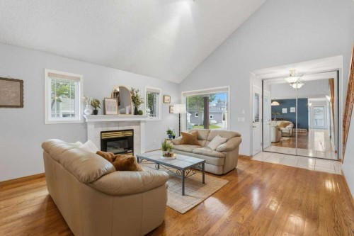 4 Inglewood Landing Se, Calgary, AB - Indoor Photo Showing Living Room With Fireplace