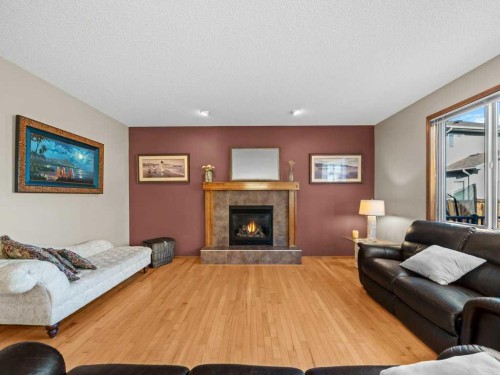 108 Pantego Rise Nw, Calgary, AB - Indoor Photo Showing Living Room With Fireplace