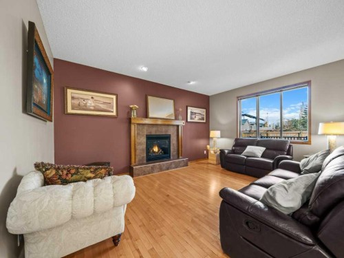 108 Pantego Rise Nw, Calgary, AB - Indoor Photo Showing Living Room With Fireplace