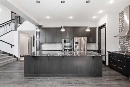 8243 Fortress Drive Sw, Calgary, AB - Indoor Photo Showing Kitchen With Stainless Steel Kitchen With Upgraded Kitchen