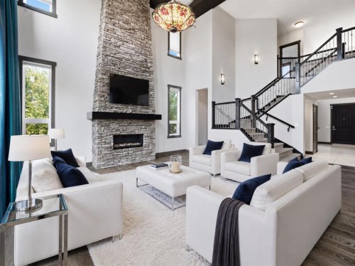 8243 Fortress Drive Sw, Calgary, AB - Indoor Photo Showing Living Room With Fireplace