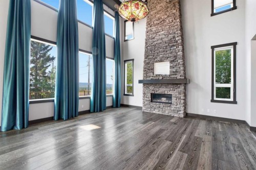 8243 Fortress Drive Sw, Calgary, AB - Indoor Photo Showing Living Room With Fireplace