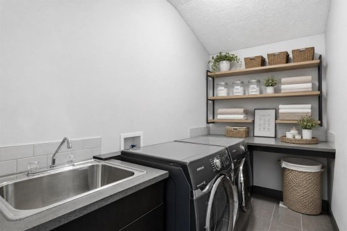 8243 Fortress Drive Sw, Calgary, AB - Indoor Photo Showing Laundry Room