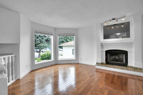 51 Del Monica Place Ne, Calgary, AB - Indoor Photo Showing Living Room With Fireplace