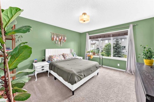 64 Sunset Square, Cochrane, AB - Indoor Photo Showing Bedroom