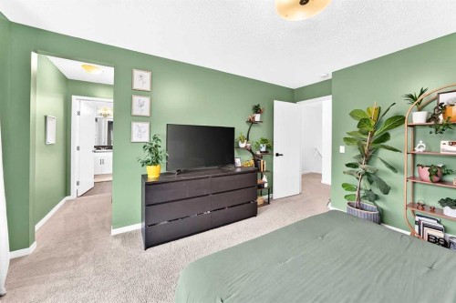 64 Sunset Square, Cochrane, AB - Indoor Photo Showing Bedroom