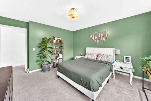 64 Sunset Square, Cochrane, AB - Indoor Photo Showing Bedroom