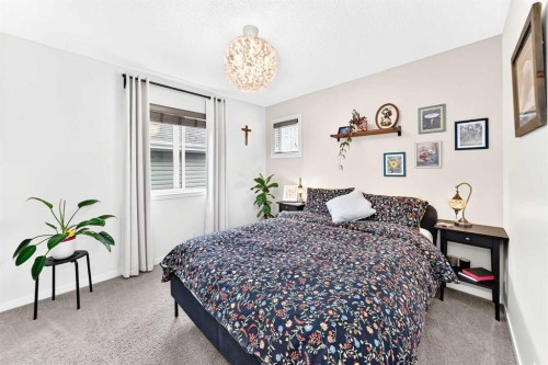 64 Sunset Square, Cochrane, AB - Indoor Photo Showing Bedroom
