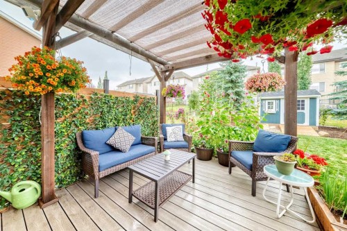 64 Sunset Square, Cochrane, AB - Outdoor With Deck Patio Veranda With Exterior