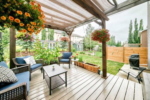 64 Sunset Square, Cochrane, AB - Outdoor With Deck Patio Veranda With Exterior