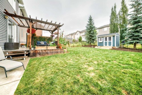 64 Sunset Square, Cochrane, AB - Outdoor With Deck Patio Veranda
