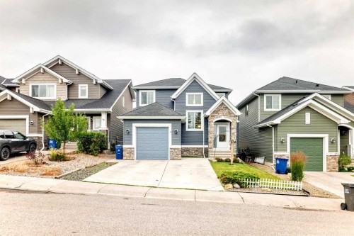 64 Sunset Square, Cochrane, AB - Outdoor With Facade