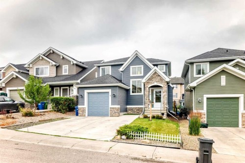 64 Sunset Square, Cochrane, AB - Outdoor With Facade