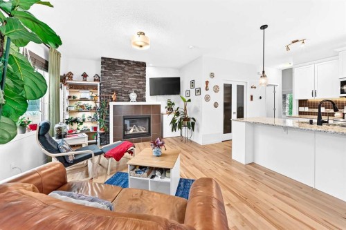64 Sunset Square, Cochrane, AB - Indoor With Fireplace