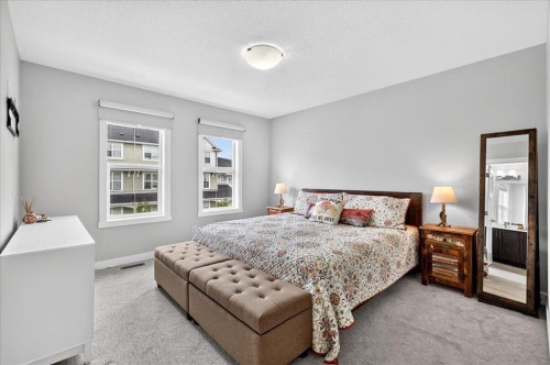 163 Copperleaf Way Se, Calgary, AB - Indoor Photo Showing Bedroom