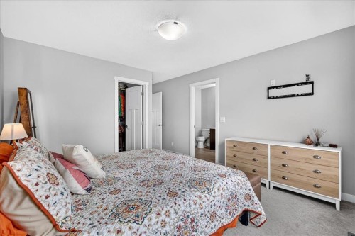 163 Copperleaf Way Se, Calgary, AB - Indoor Photo Showing Bedroom
