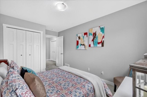 163 Copperleaf Way Se, Calgary, AB - Indoor Photo Showing Bedroom