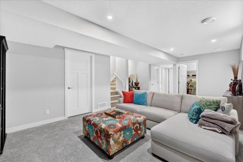 163 Copperleaf Way Se, Calgary, AB - Indoor Photo Showing Living Room