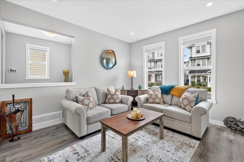 163 Copperleaf Way Se, Calgary, AB - Indoor Photo Showing Living Room