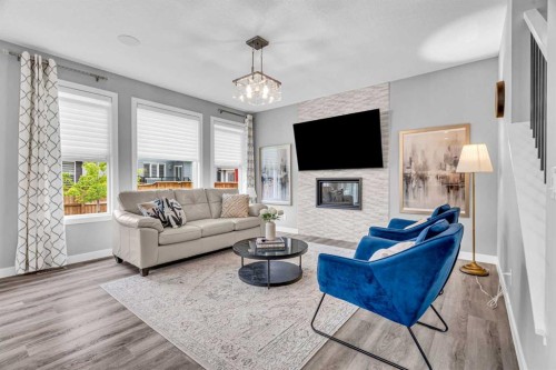 49 Creekside Avenue Sw, Calgary, AB - Indoor Photo Showing Living Room With Fireplace