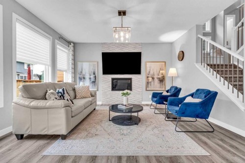 49 Creekside Avenue Sw, Calgary, AB - Indoor Photo Showing Living Room With Fireplace