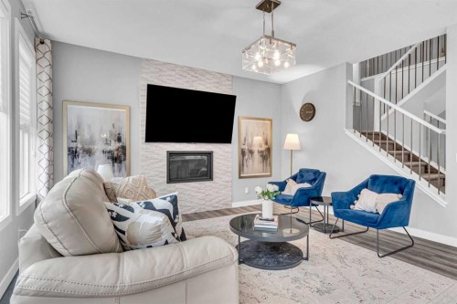 49 Creekside Avenue Sw, Calgary, AB - Indoor Photo Showing Living Room With Fireplace