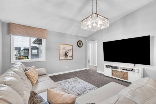 49 Creekside Avenue Sw, Calgary, AB - Indoor Photo Showing Living Room