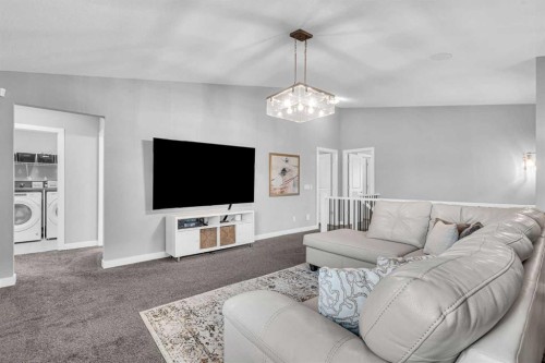 49 Creekside Avenue Sw, Calgary, AB - Indoor Photo Showing Living Room