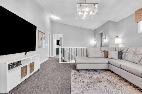 49 Creekside Avenue Sw, Calgary, AB - Indoor Photo Showing Living Room