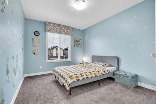 49 Creekside Avenue Sw, Calgary, AB - Indoor Photo Showing Bedroom